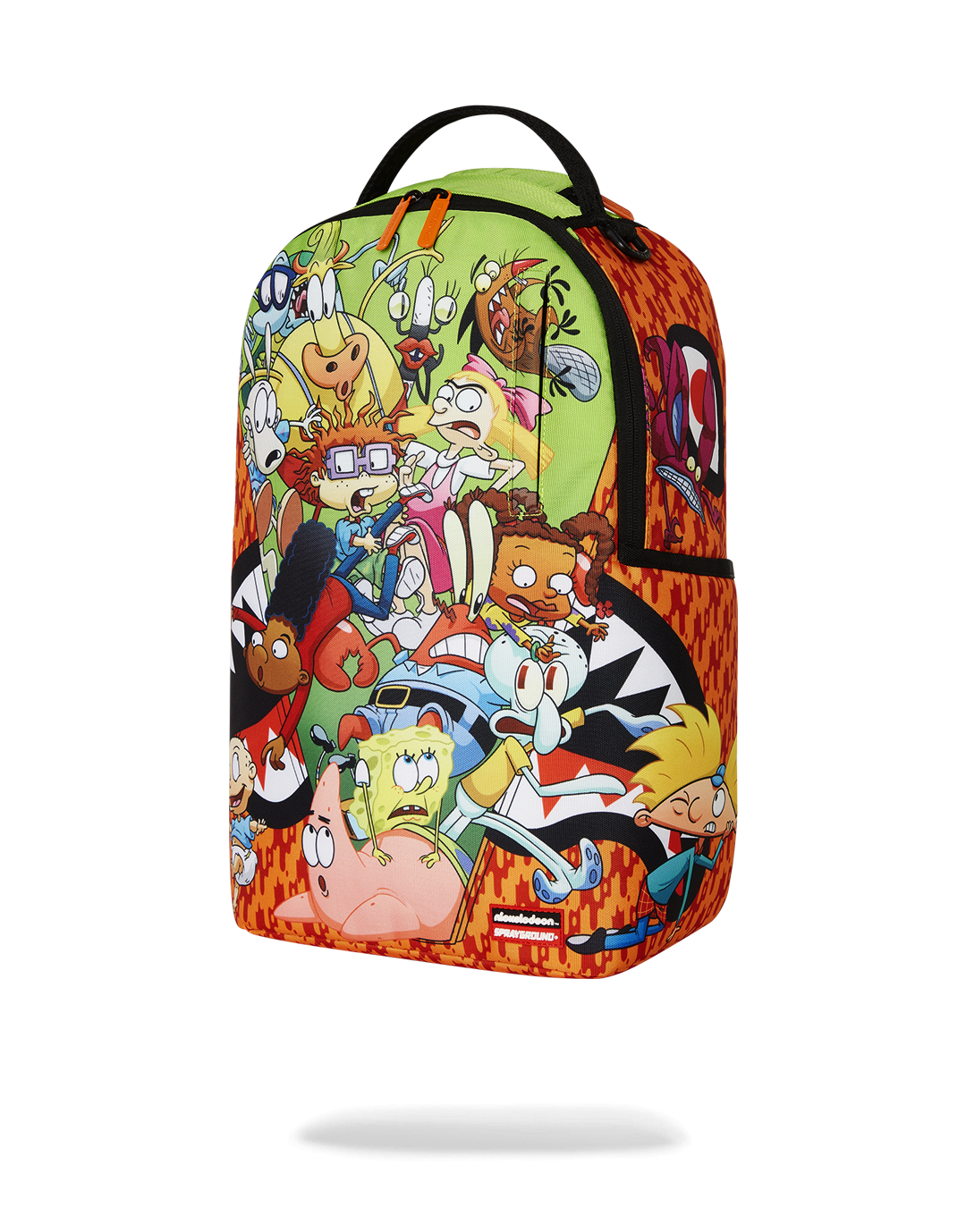 Side angle of the kids travel backpack placed beside a carry-on luggage piece.