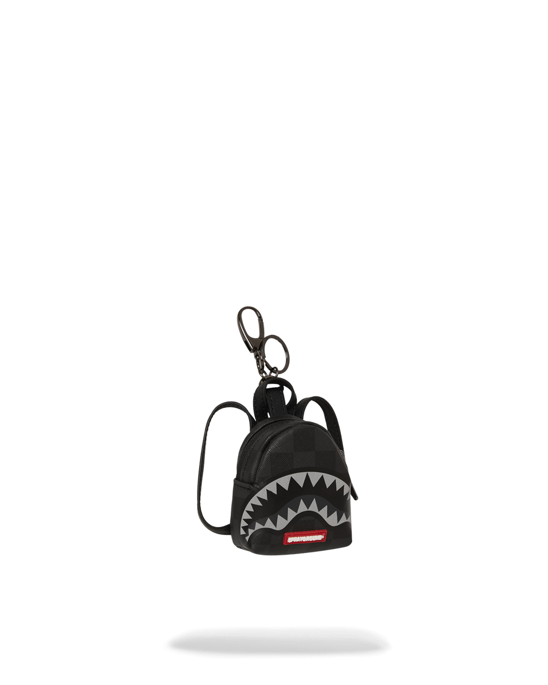 Side view of the lightweight backpack keychain in hand