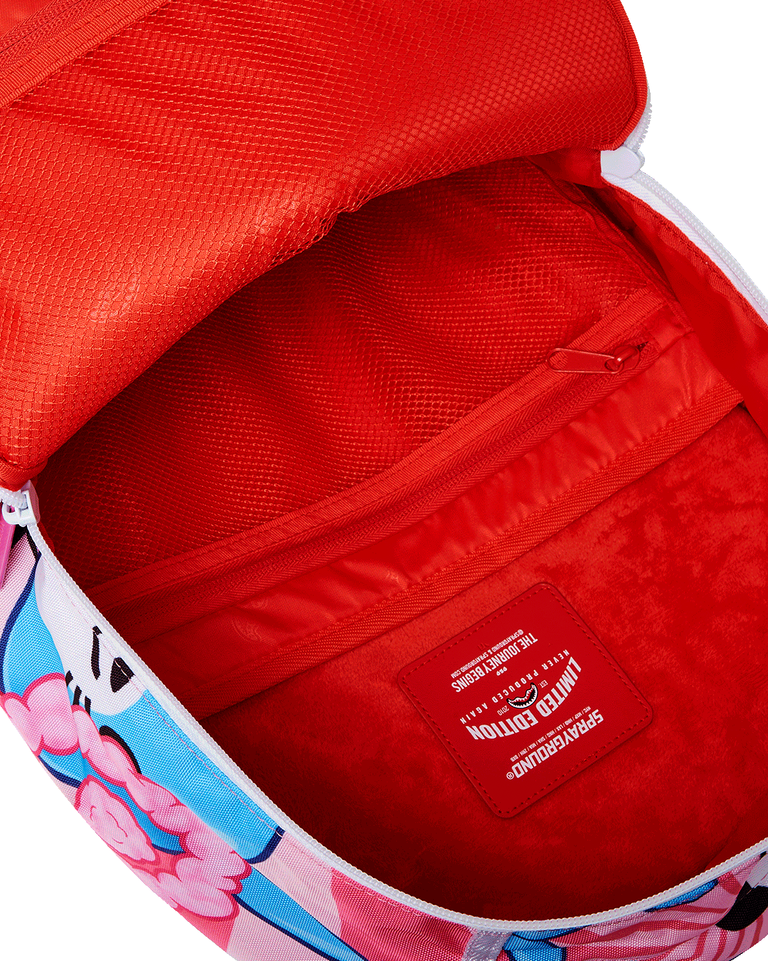 Back sleeve detail connecting backpack to carry-on luggage—ideal for travel