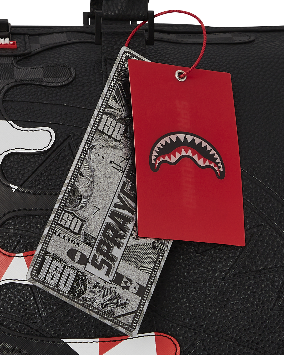 Adjustable strap detail on leather duffle bag for custom fit
