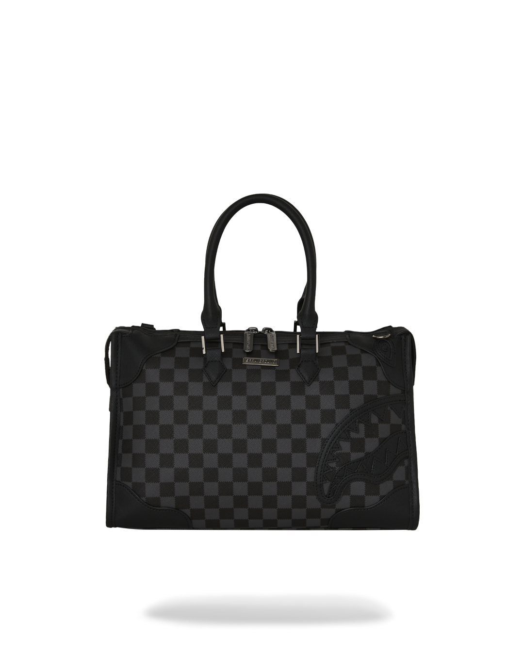 Midnight Chateau mini duffle crossbody bag displayed on a table with strap extended