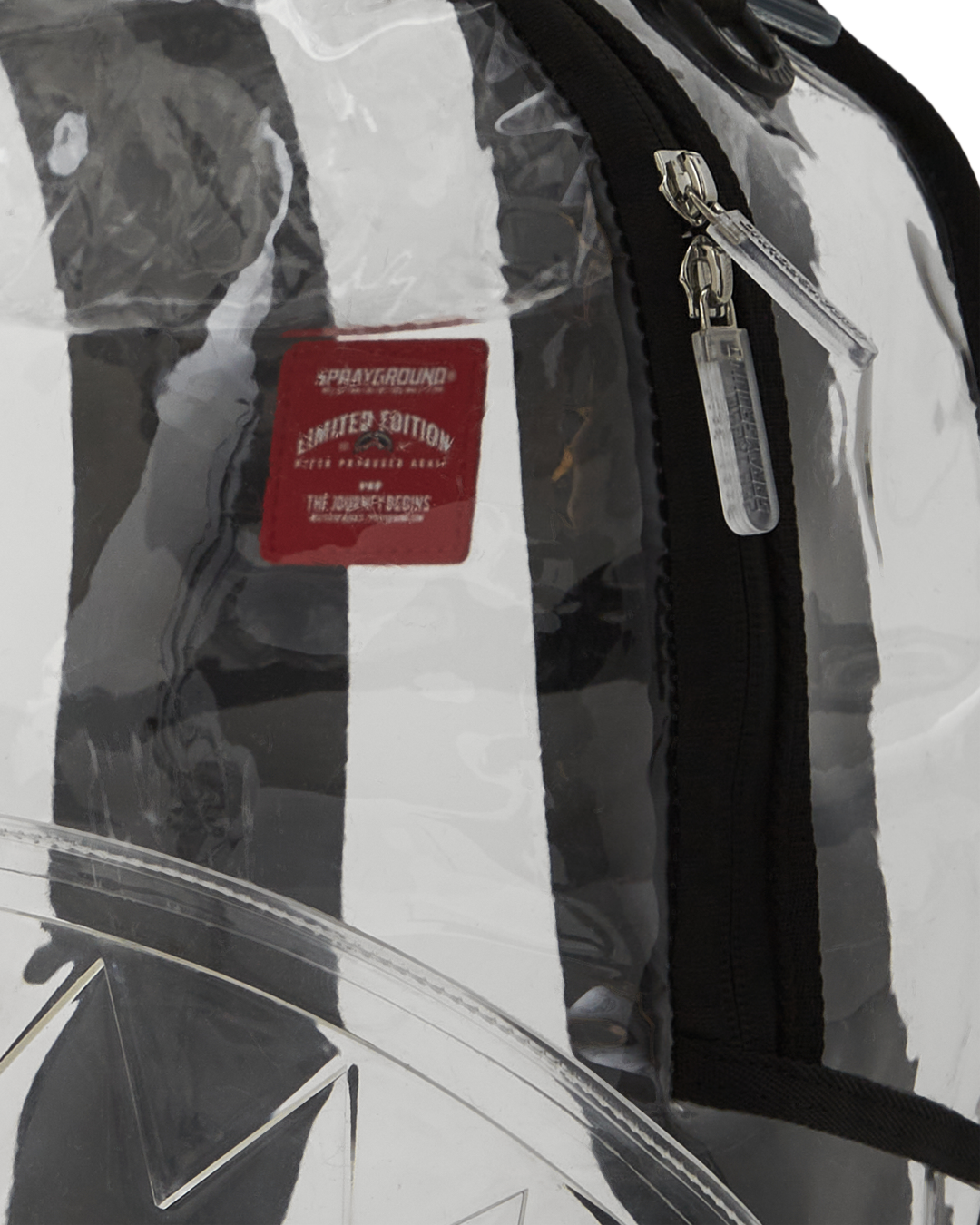 Close-up of the backpacks front zipper pocket and sharkmouth design.