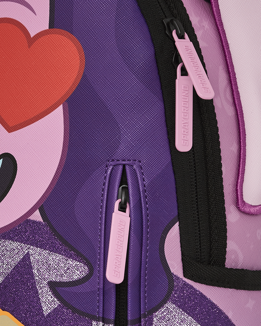 Interior shot of the spacious zipper compartments and mesh pocket