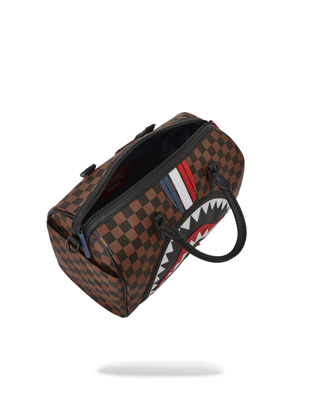 Mini faux leather duffle bag worn as a crossbody bag, showcasing its stylish design.