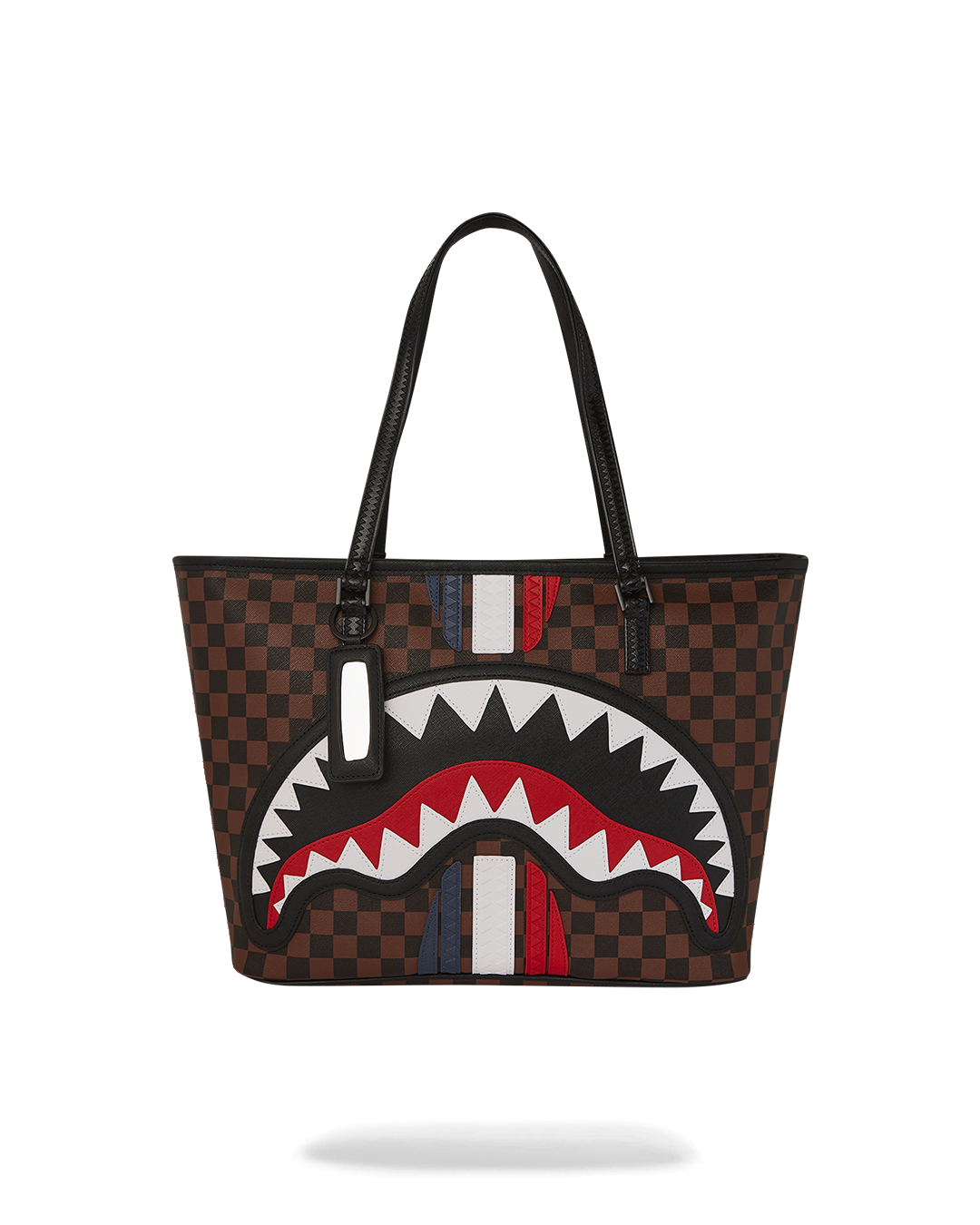 Sprayground Sharks in Paris tote bag shown on a park bench, highlighting its spacious interior