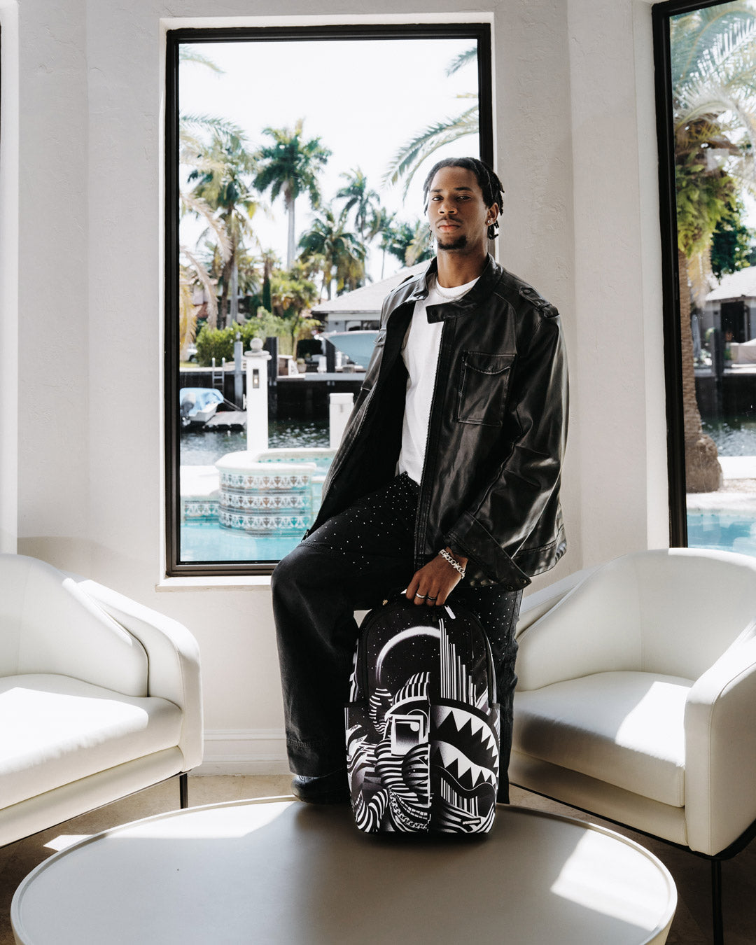 DLXR backpack with adjustable straps and gold zippers