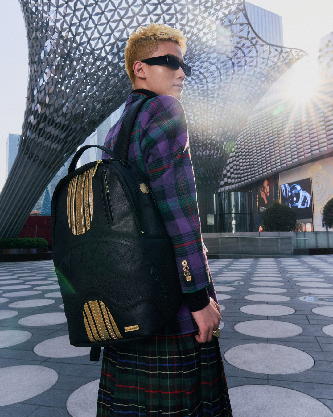 Racing Stripes Faux Leather Backpack with gold zipper and metal hardware, showcasing the front zipper pocket.