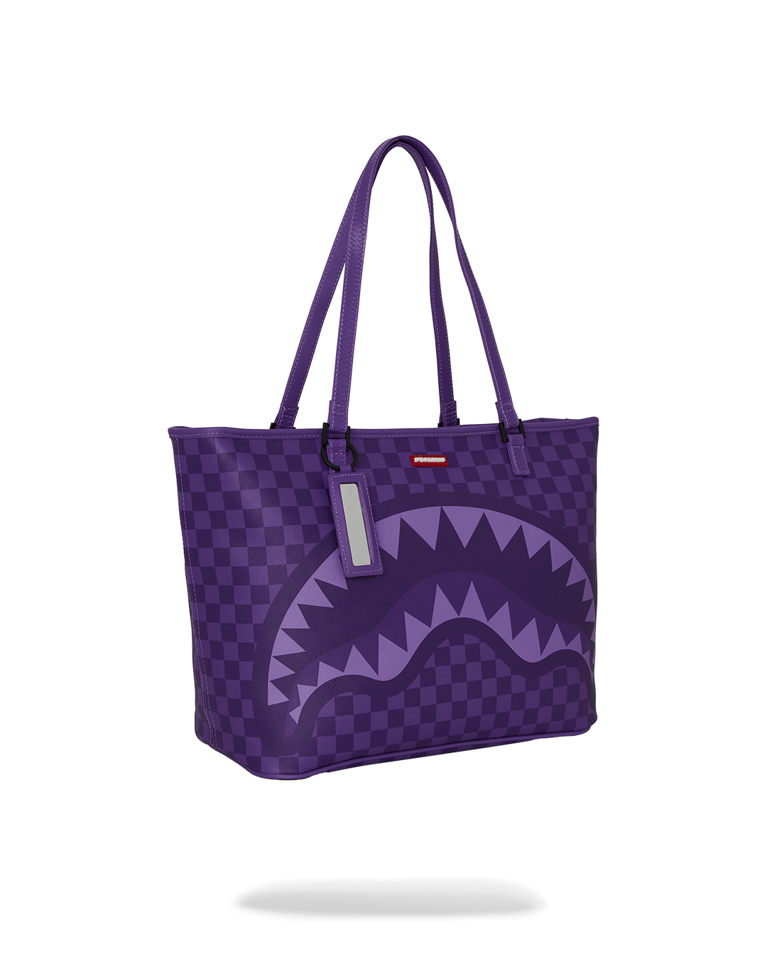 Sprayground Faux Leather Leopard Print Tote Bag being carried, highlighting its top double handle and D-ring key clip.