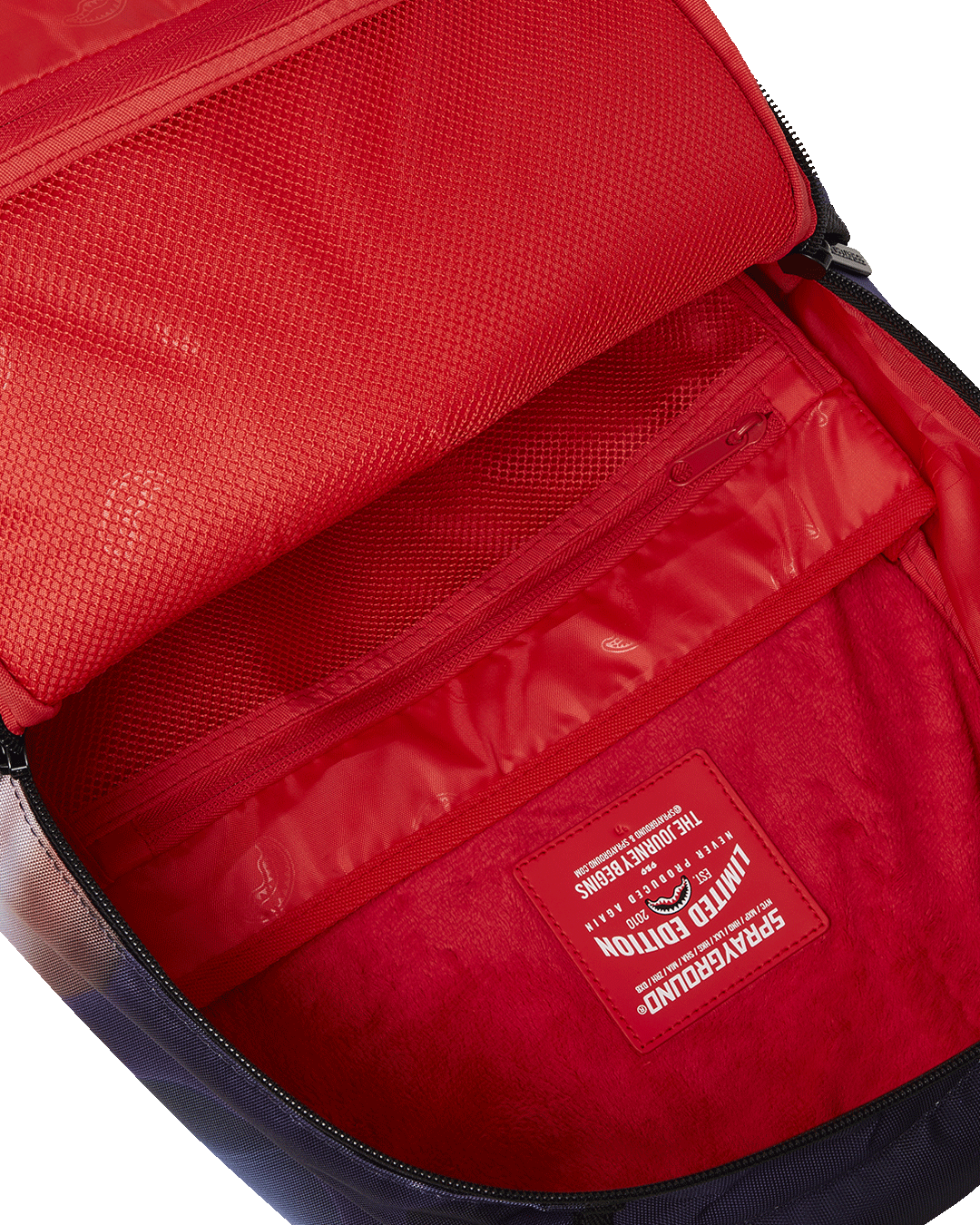 Front view of AstroGalaxy Queen backpack showing embossed sharkmouth design and gold zippers