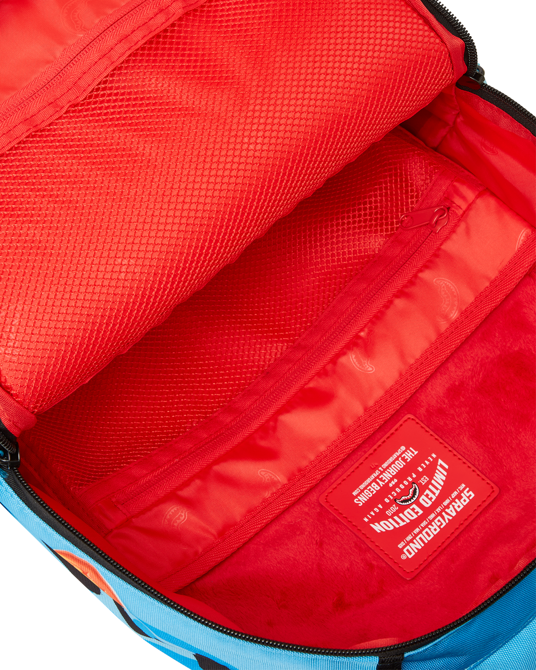 Back view of the Anime backpack, highlighting its ergonomic mesh back padding and slide-through back sleeve for carry-on luggage.