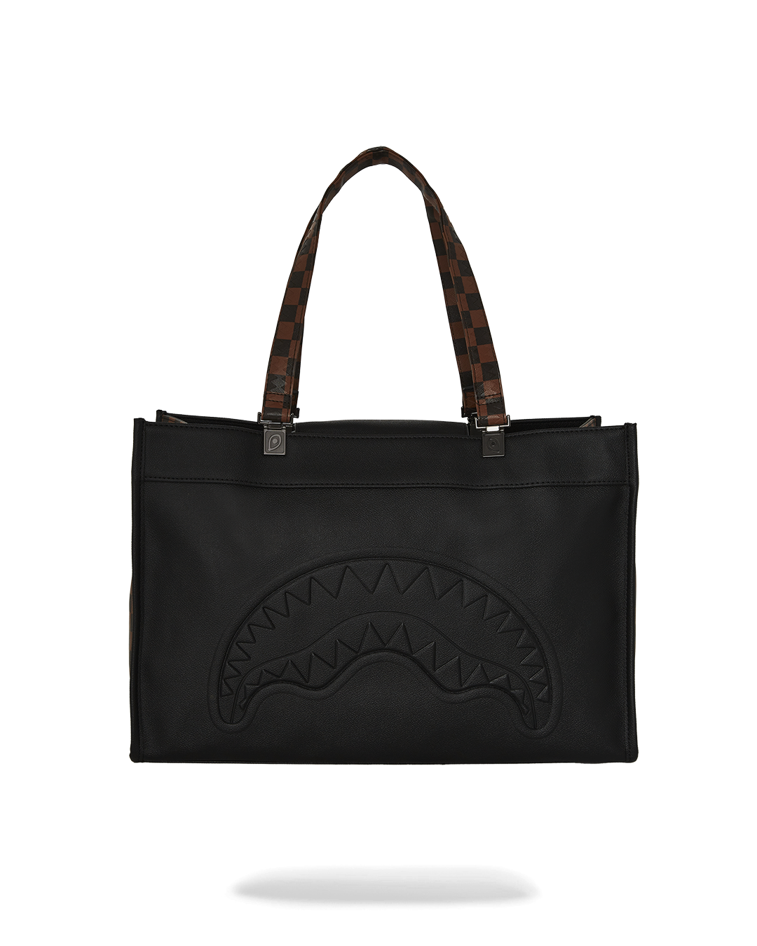 Woman carrying crossbody tote bag in city setting