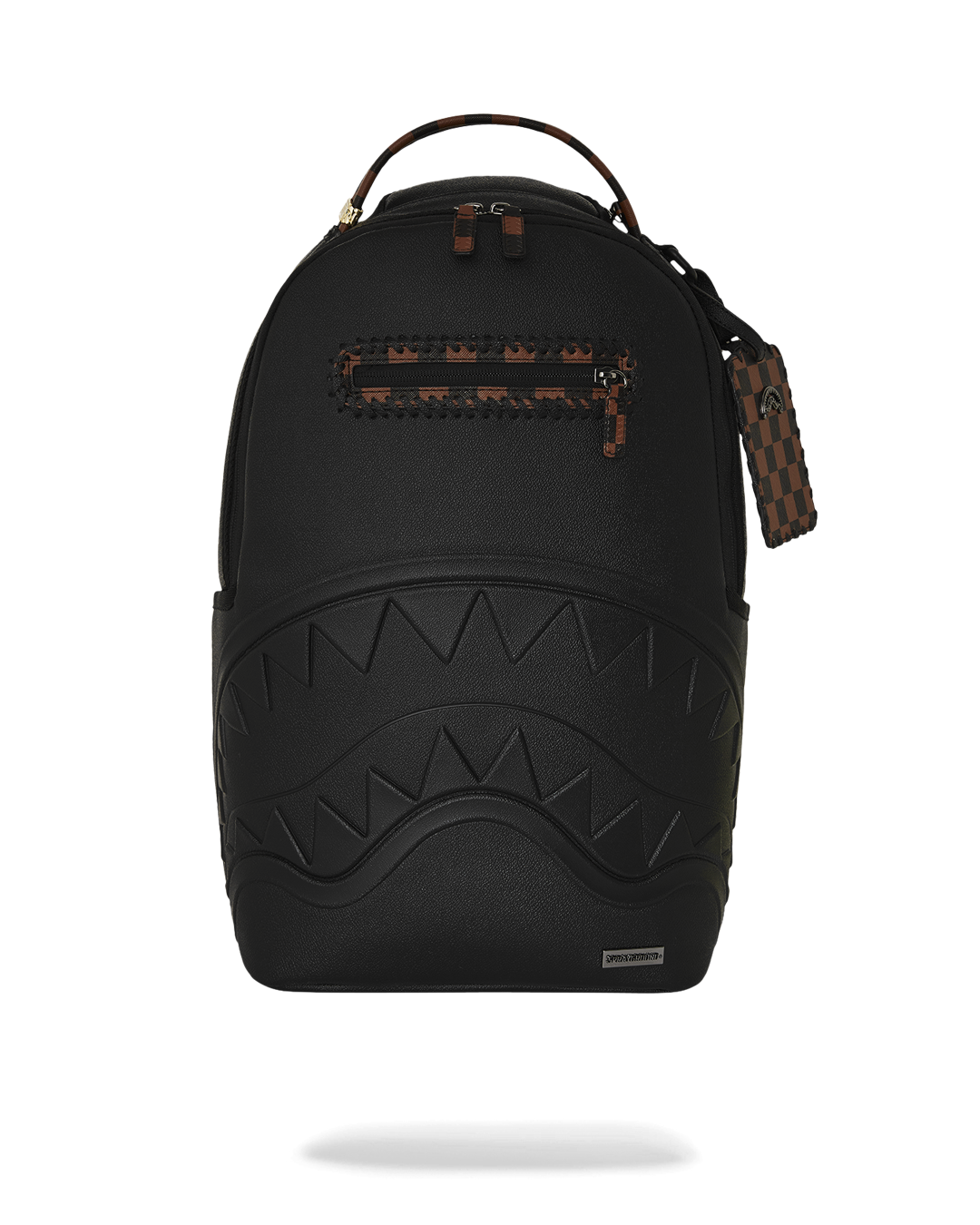 Close-up of embossed sharkmouth detail on faux leather backpack