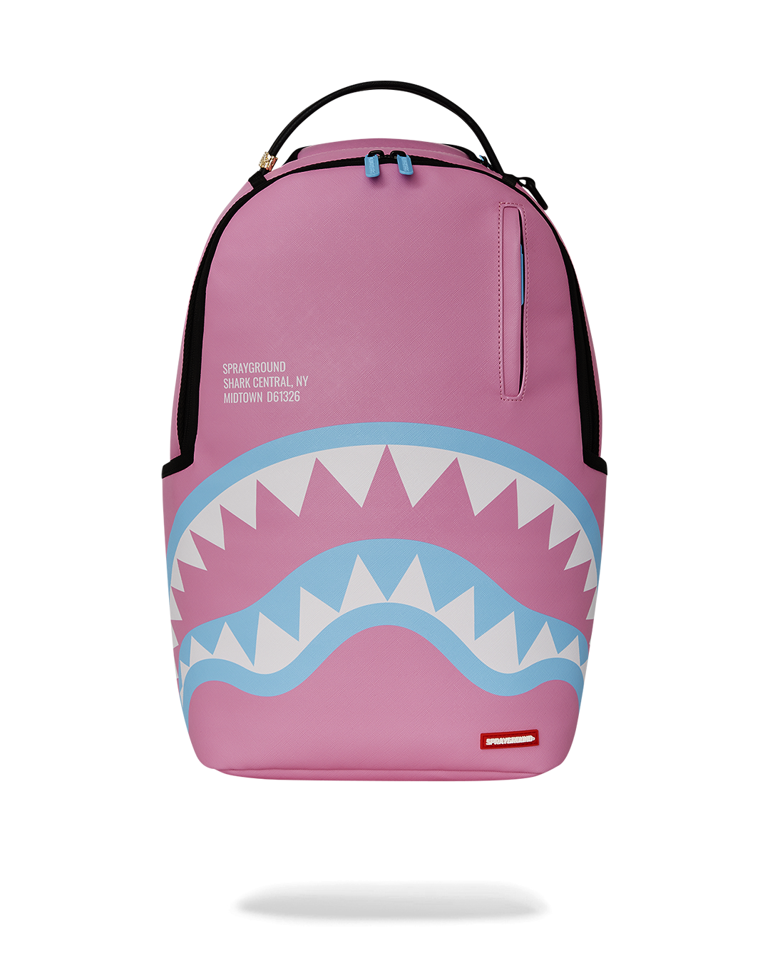 Shark Central faux leather backpack worn over one shoulder in urban setting