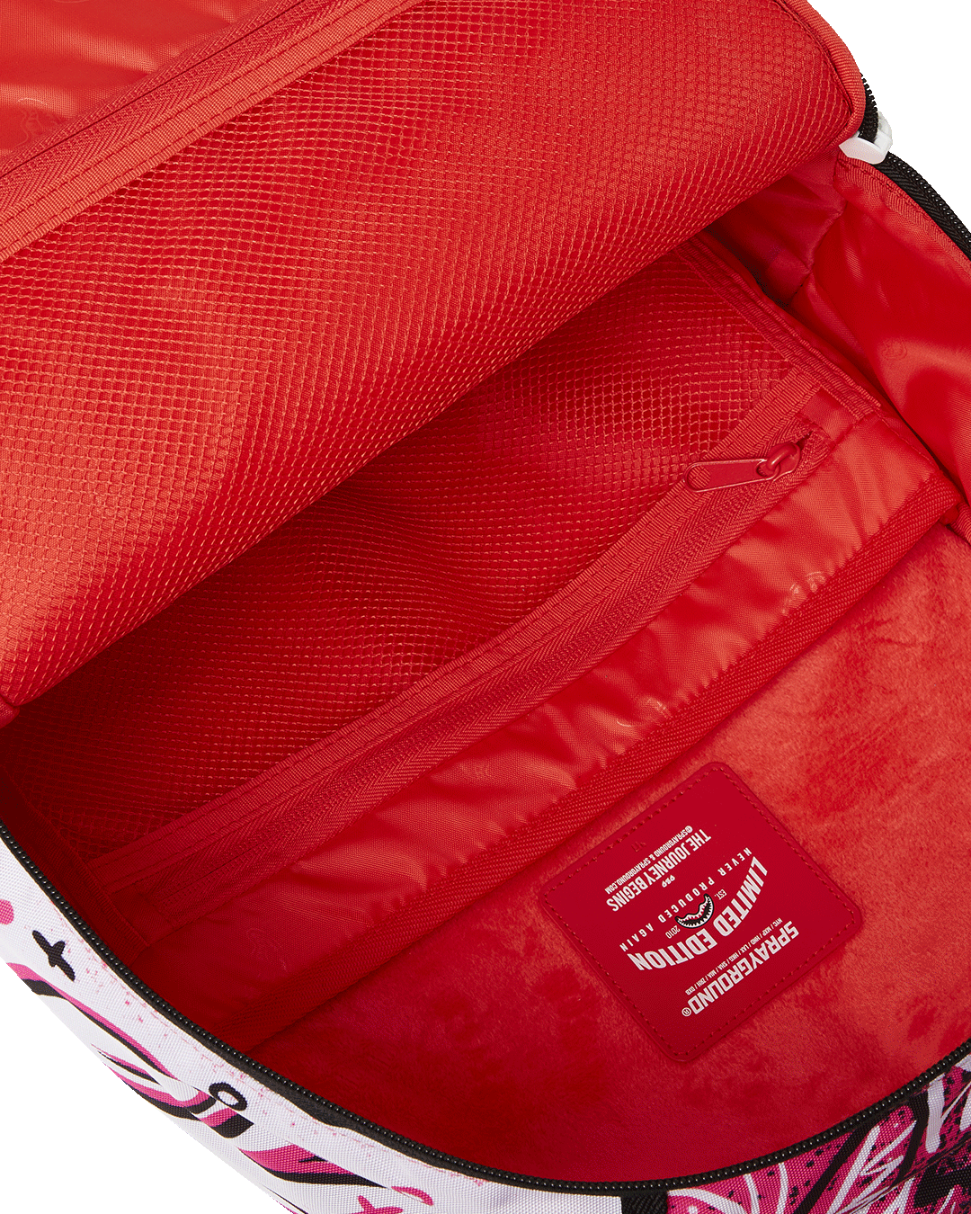 Peak Design Backpack DLXR front view, highlighting the front zipper pocket and side pockets.