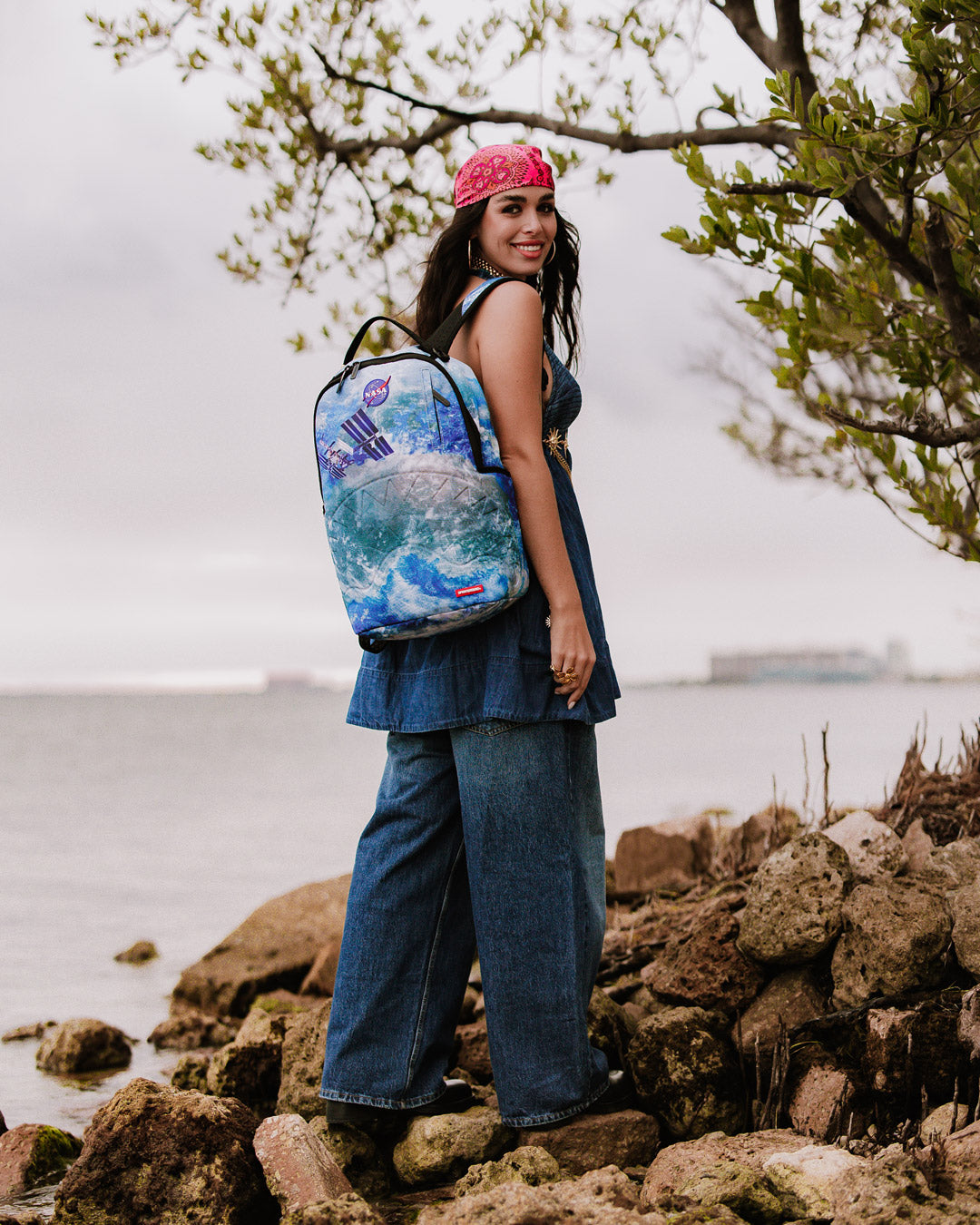 Sprayground NASA Collaboration Limited Edition Laptop Backpack from the front, showcasing its embossed design and front zipper pocket.