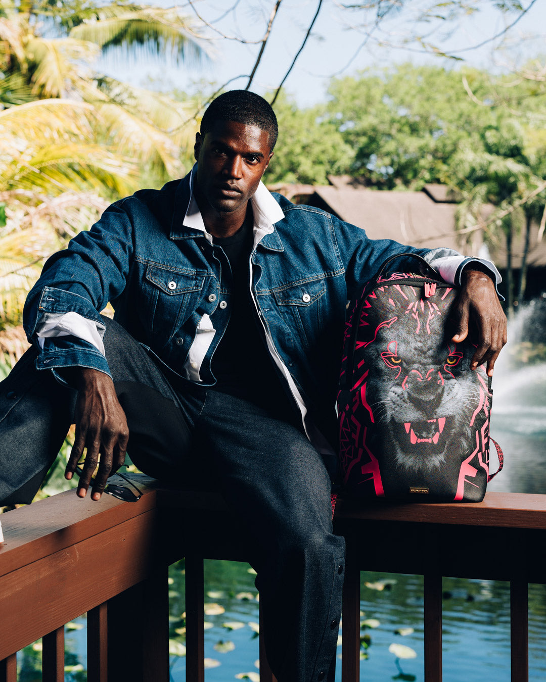 African Intelligence backpack in faux leather, showcasing front zipper pockets