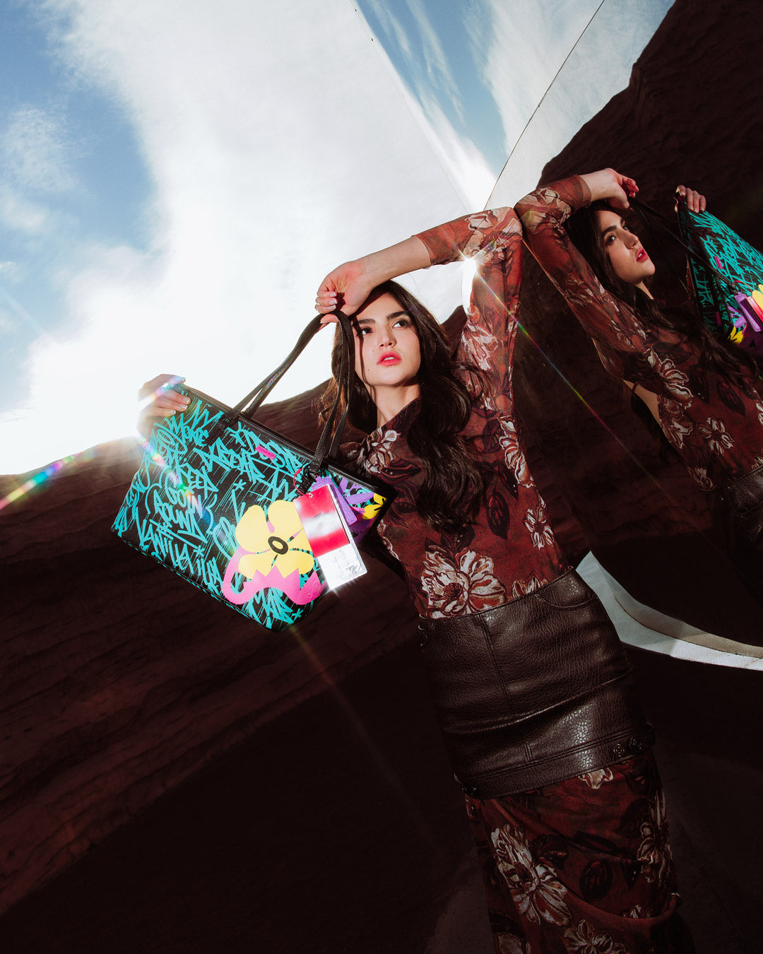 Sprayground Garden Glamour Tote held casually over the shoulder in a city setting