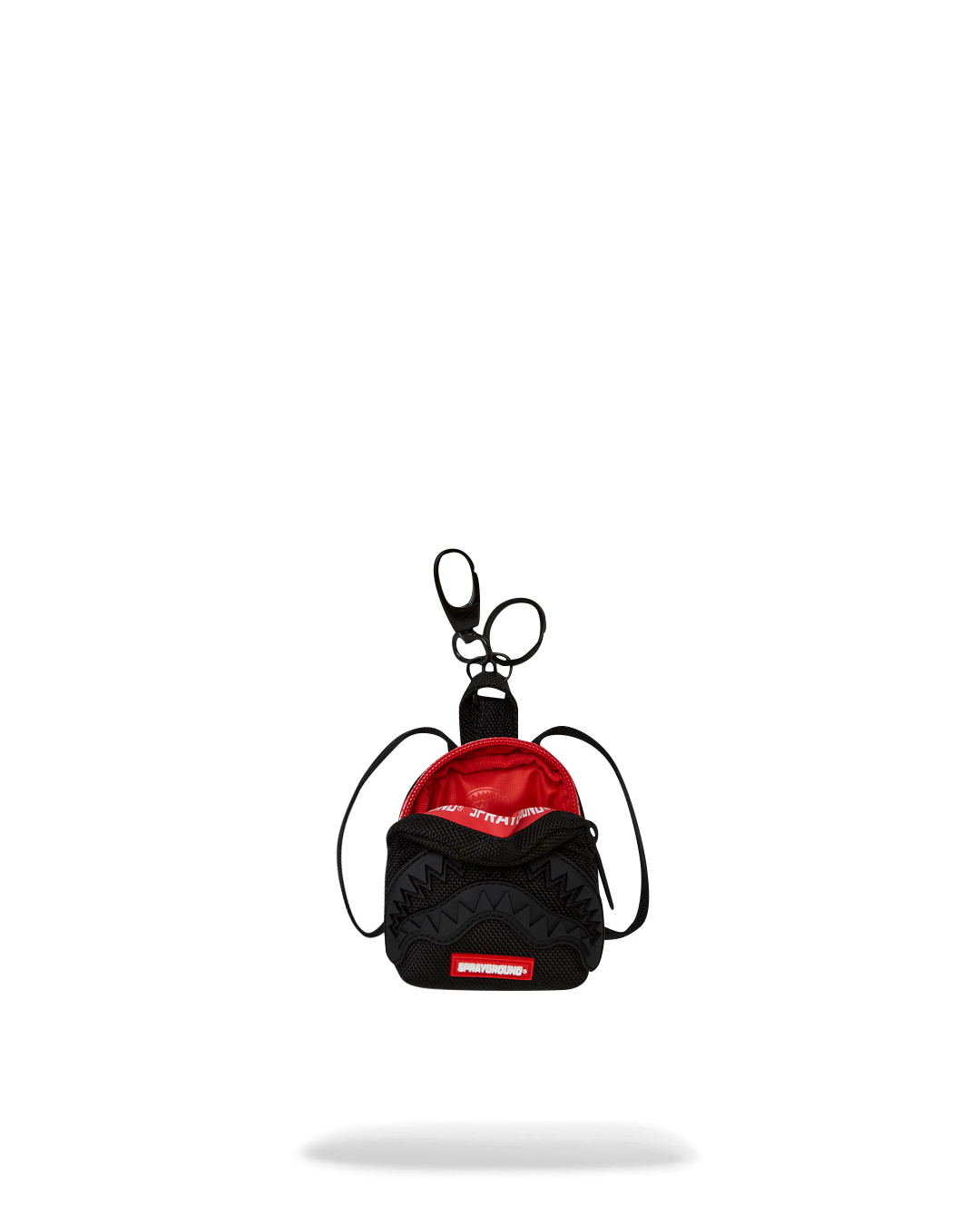 Lululemon keychain mini pouch attached to a backpack, showcasing its travel accessory functionality.