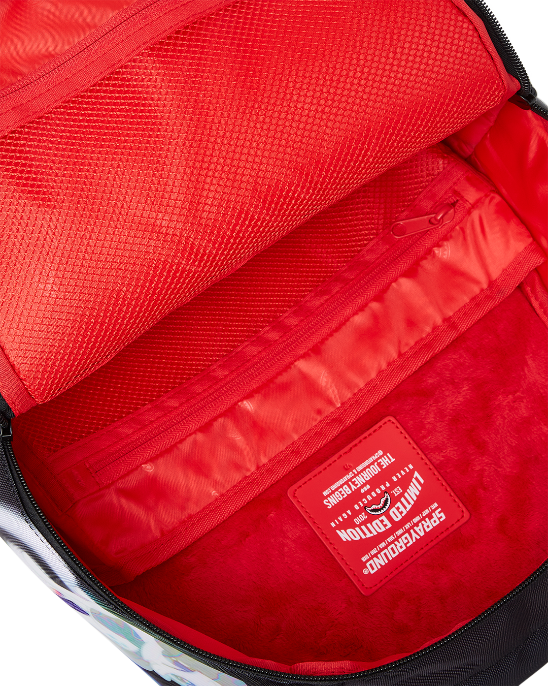 Side angle showing spacious compartments and adjustable straps