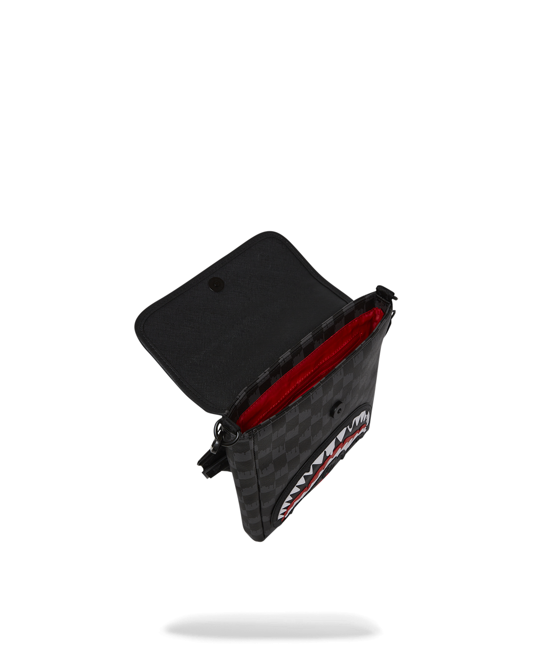 Interior shot of the sling bag showing zipped compartments