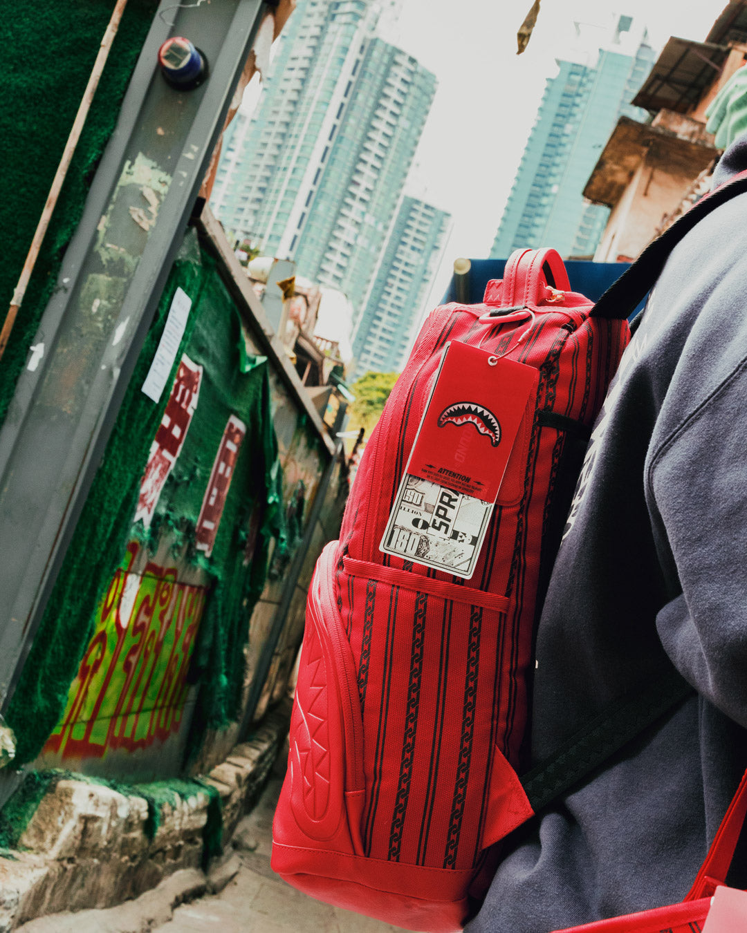 Traveler wearing the SkyChain SupplyChain backpack while hiking through a scenic trail