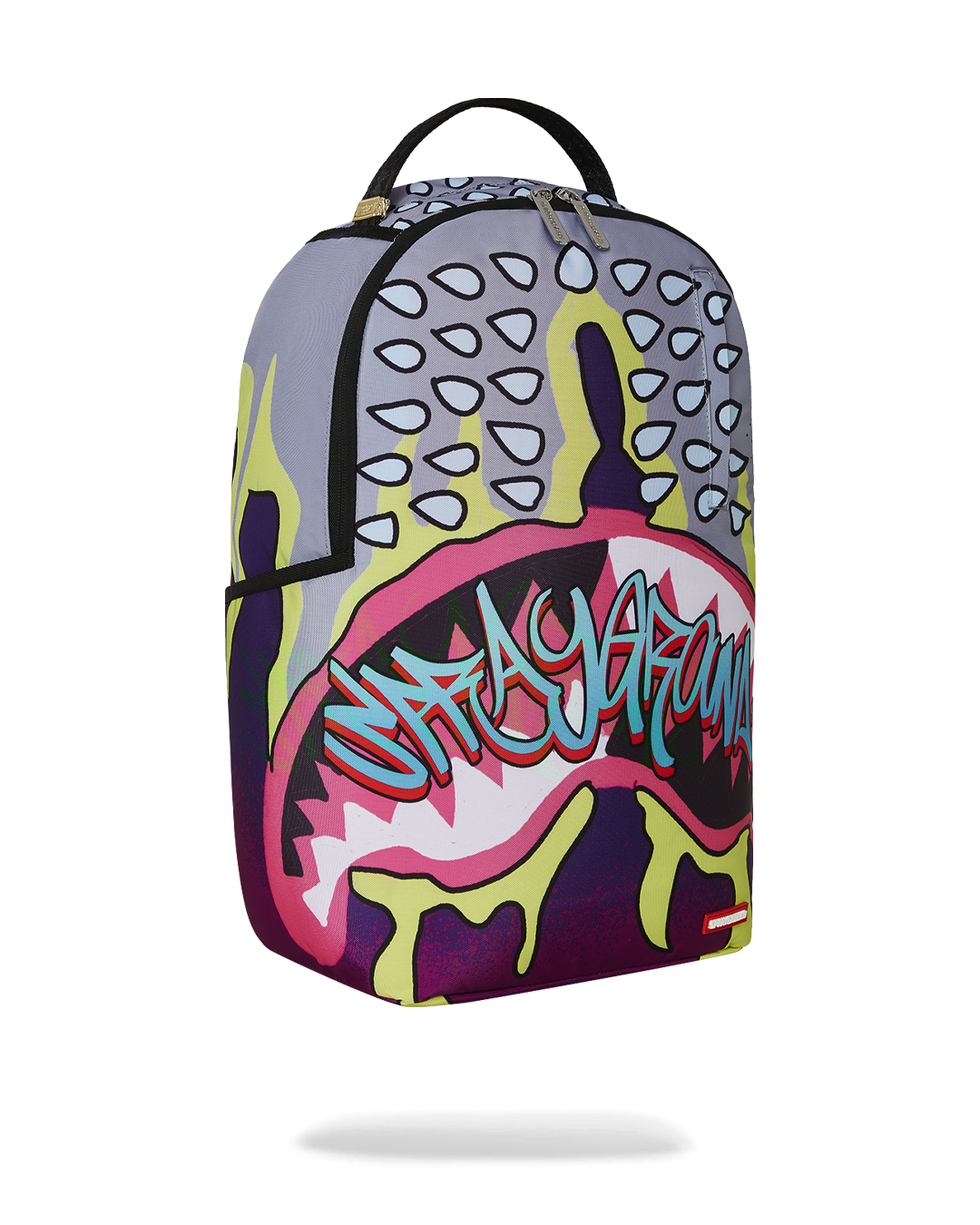 Daybreak Luxe backpack in a travel setting, attached to luggage.