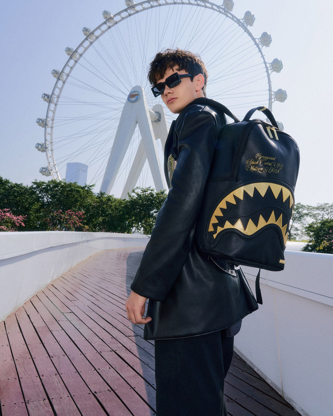 BAPE Shark backpack with faux leather finish and gold accents, interior view showing laptop compartment