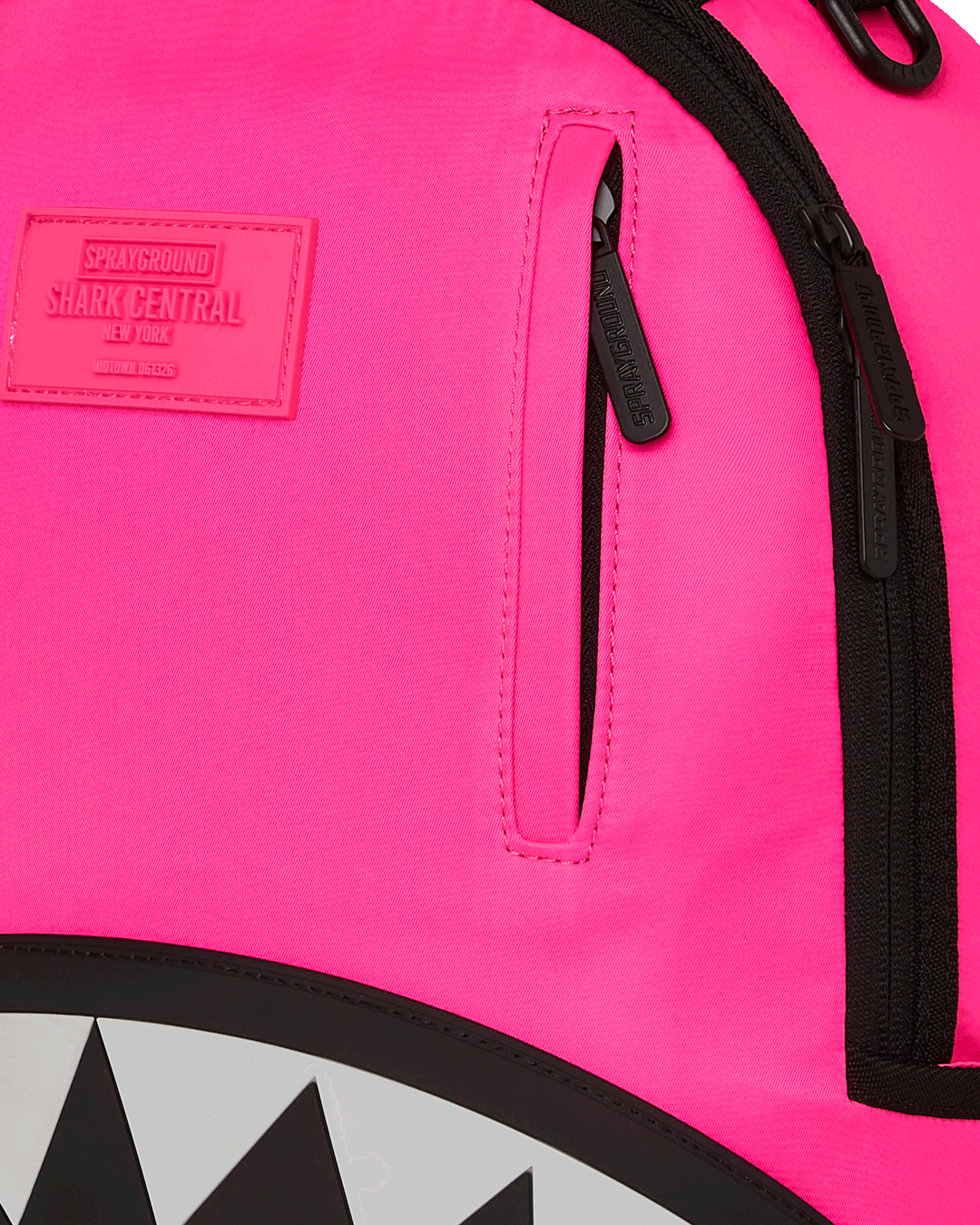 Front angle view showing backpacks gold zipper and rubber detailing