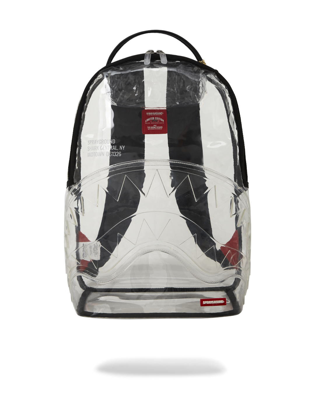 Clear Sprayground shark backpack worn on back, showing off its transparent PVC material and multiple pockets.