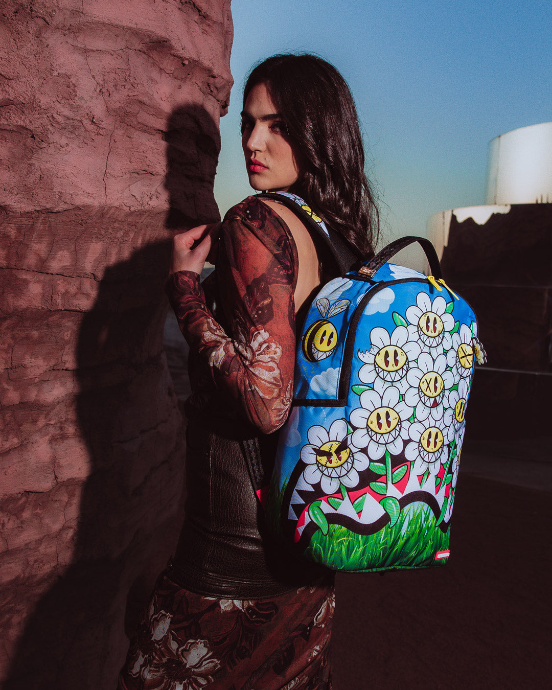 Sprayground Crazy Daisy Backpack with daisies and clear front pocket