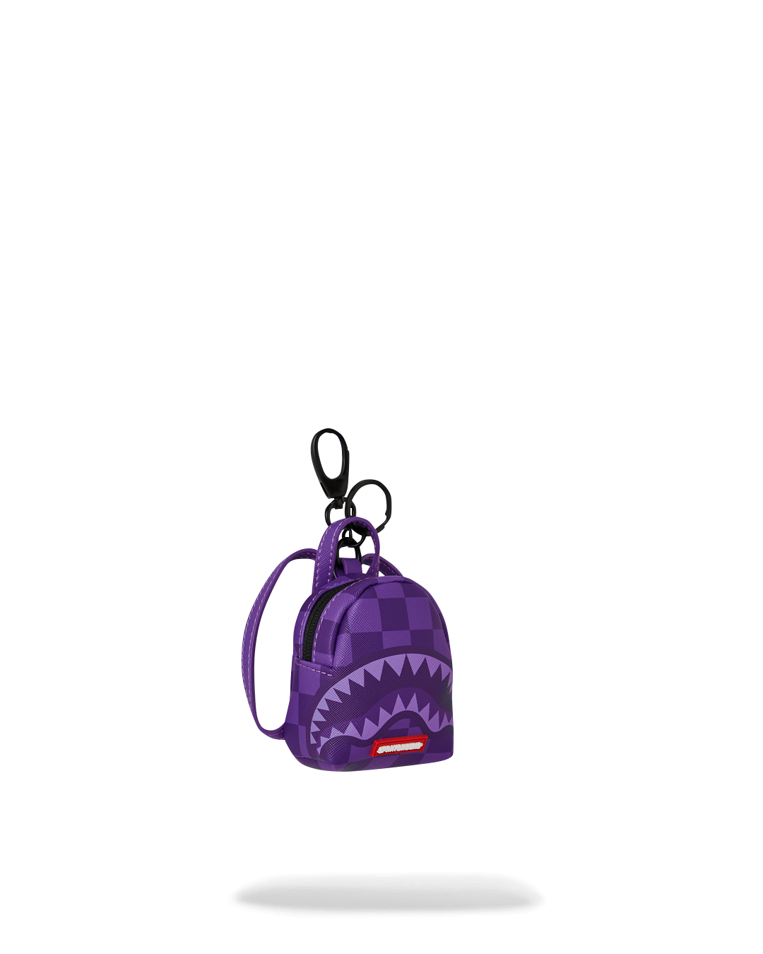 Small utility keychain holding coins and earbuds, perfect for on-the-go convenience