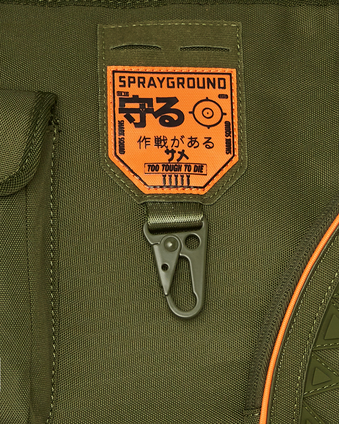 Front view of Sprayground shark tote bag on urban city street