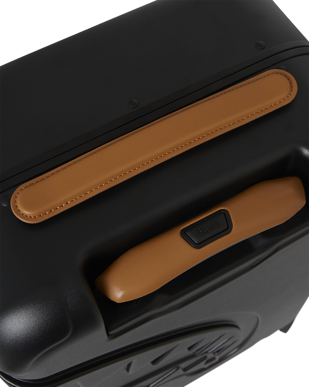 Front view of Sharkitecture Jetstream hard shell suitcase with shark sculpture.