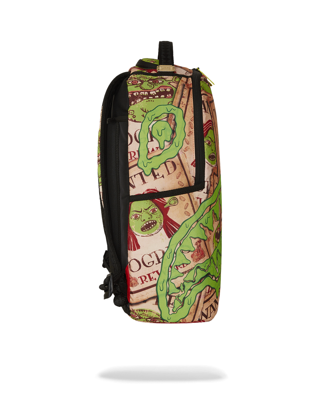Sprayground SHREK WANTED backpack in use, connected to carry-on luggage