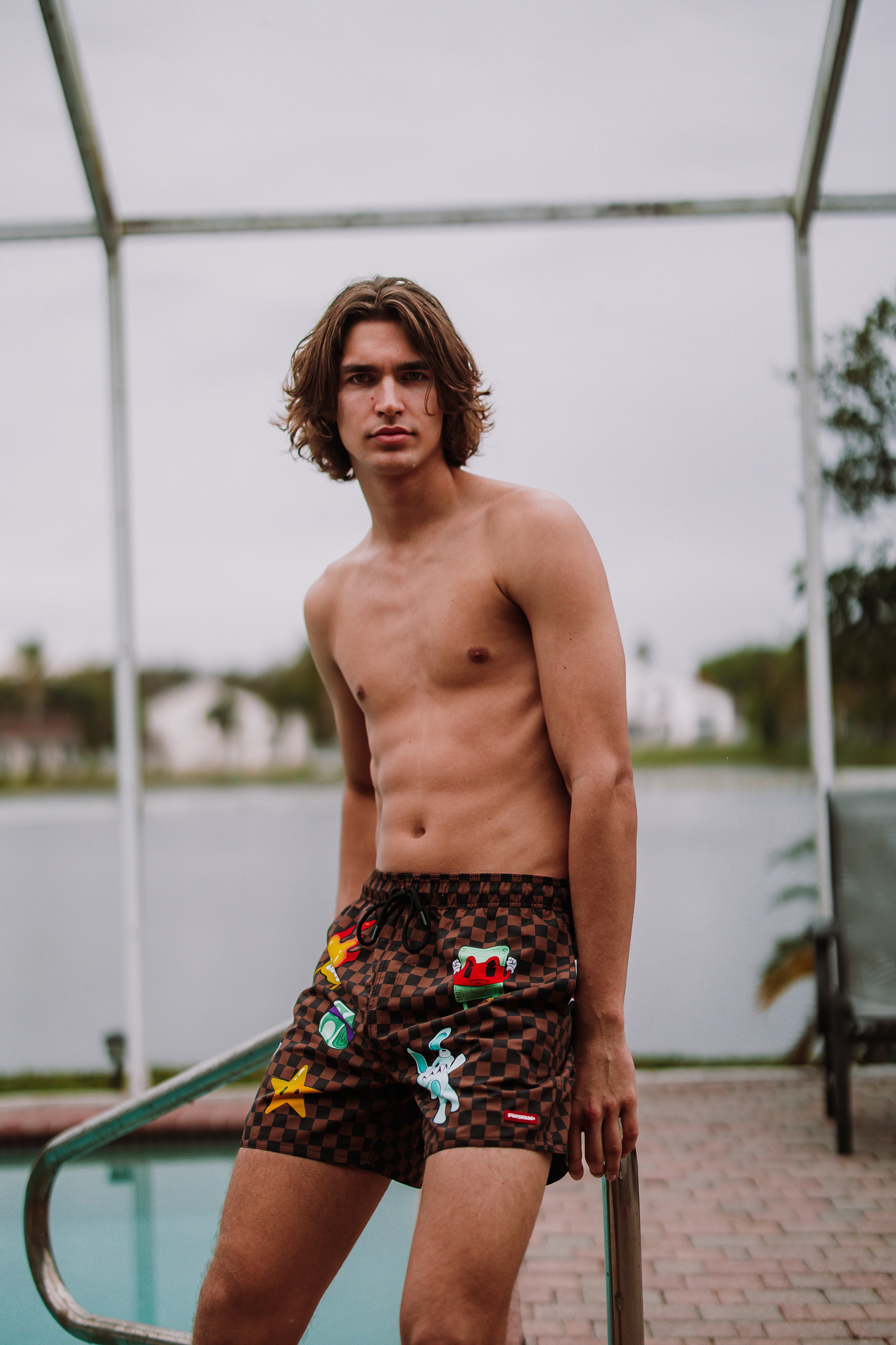 Detailed view of the swim shorts fabric and side pockets.