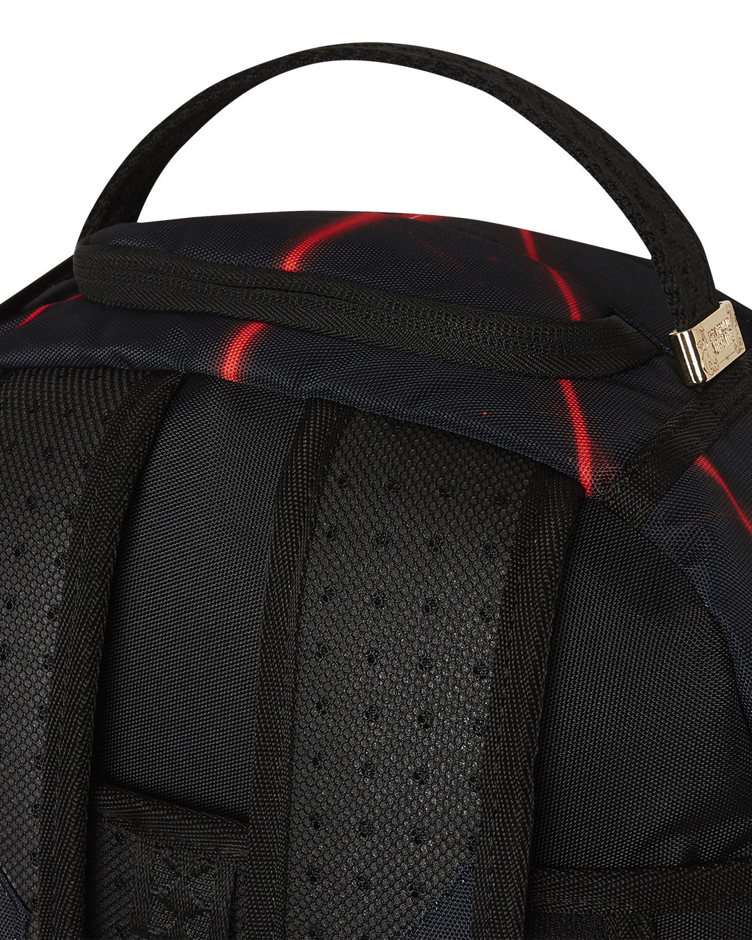 Sprayground Shark Backpack in pink, highlighting its adjustable straps and gold zippers with metal hardware.