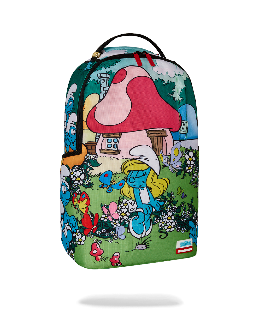 Child wearing Smurfs cartoon backpack during outdoor play.