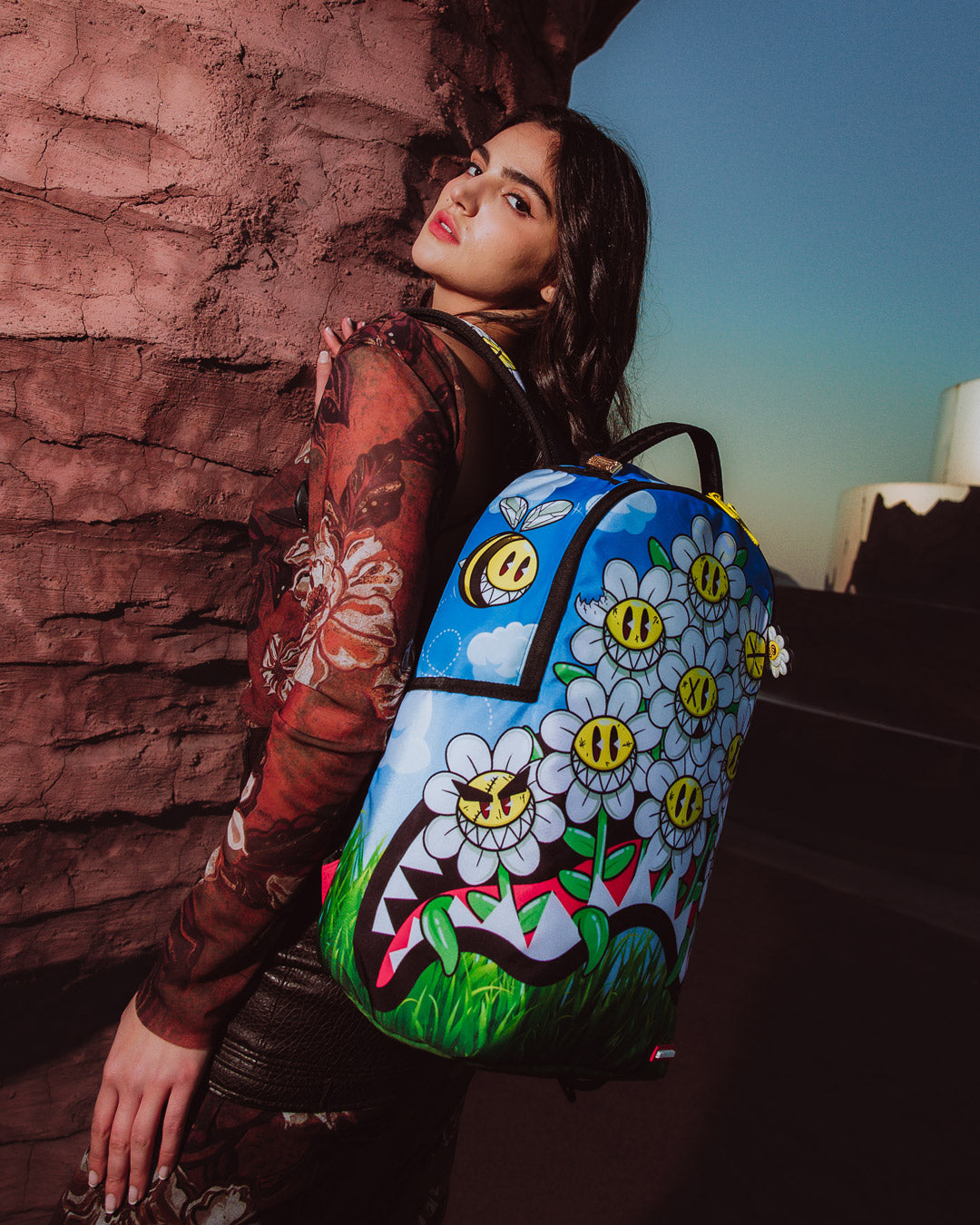 Sprayground Crazy Daisy Backpack with side pockets and zippered stash pocket