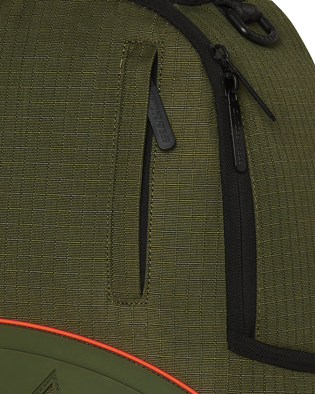 Closeup of shark backpack front showing rubber mouth and gold zipper