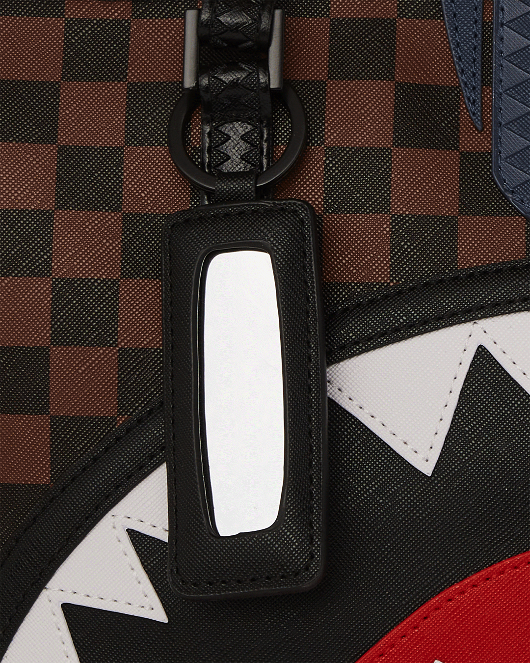Sprayground Sharks in Paris tote bag shown on a park bench, highlighting its spacious interior
