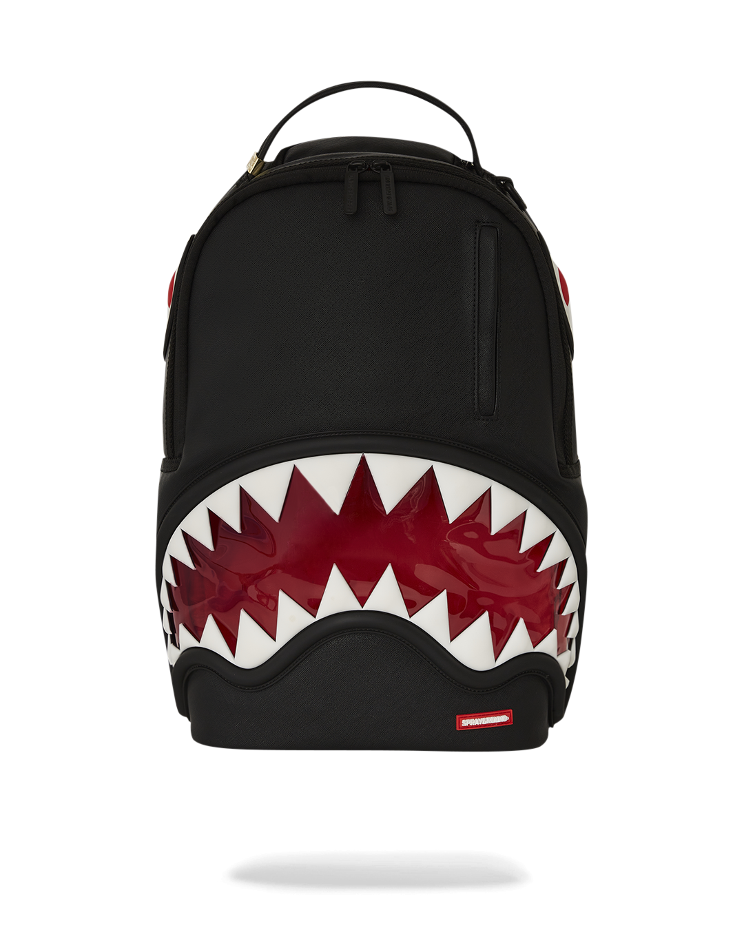 Front view of clear backpack with shark bite design and gold zippers