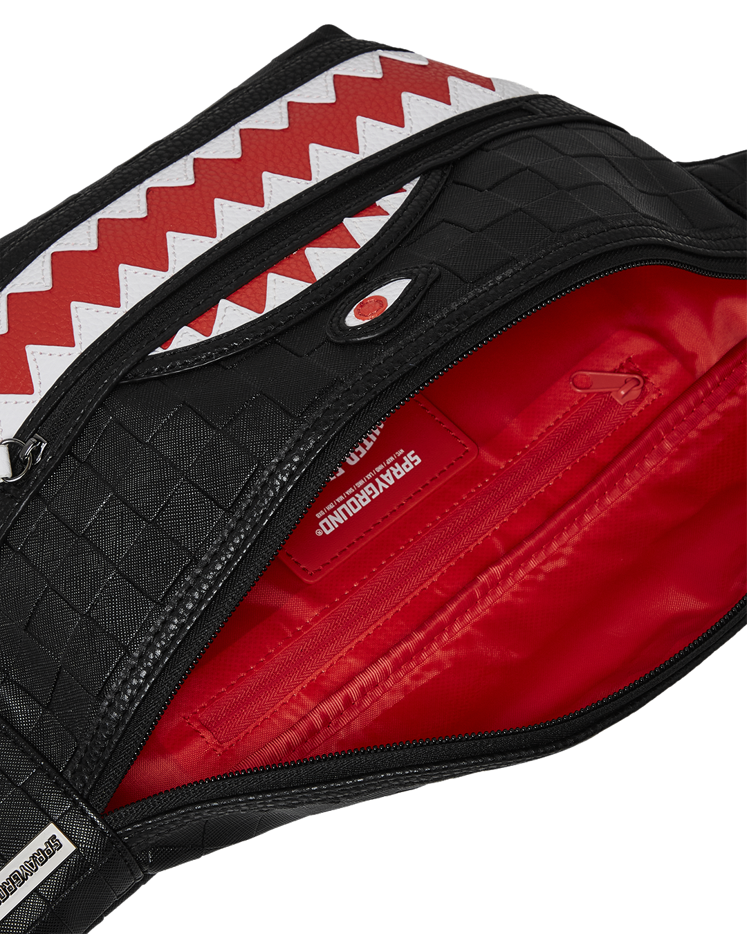 Front view of the black crossbody bag with cargo pocket detail