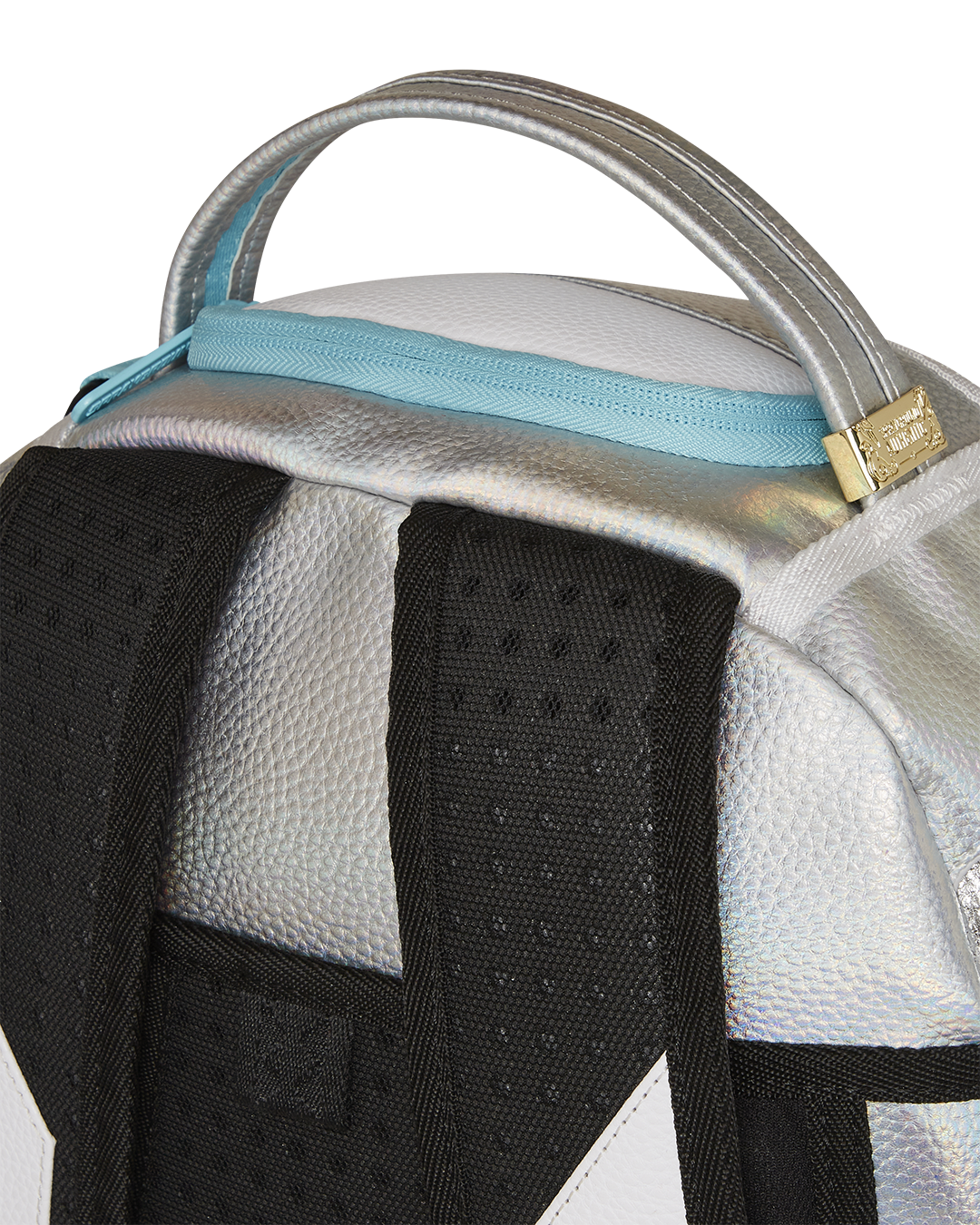 Back view with luggage pass-through sleeve and gold hardware detailing for everyday travel