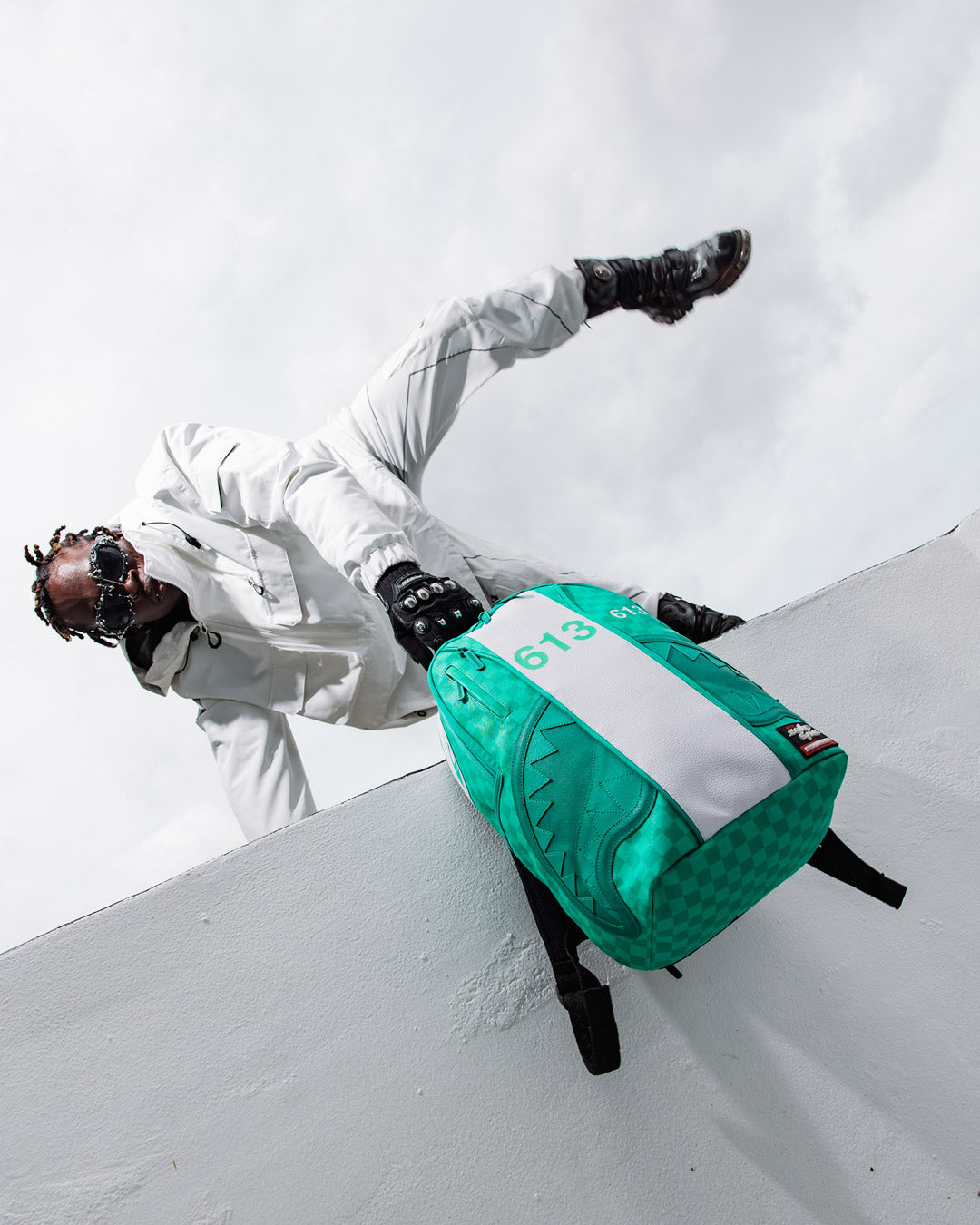 Ergonomic mesh back padding of the Sharkmouth backpack, designed for comfort during long wear.