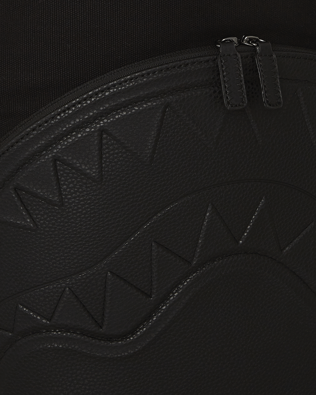 Canvas backpack with adjustable straps and gold zippers, perfect for travel and daily use.
