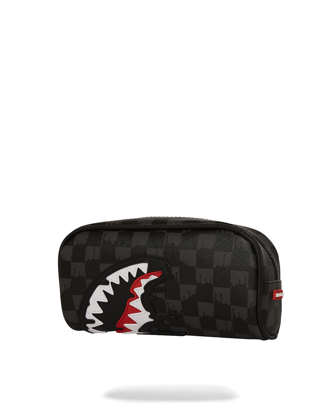 Sharks in Paris pouch being used to store makeup brushes and cosmetics.