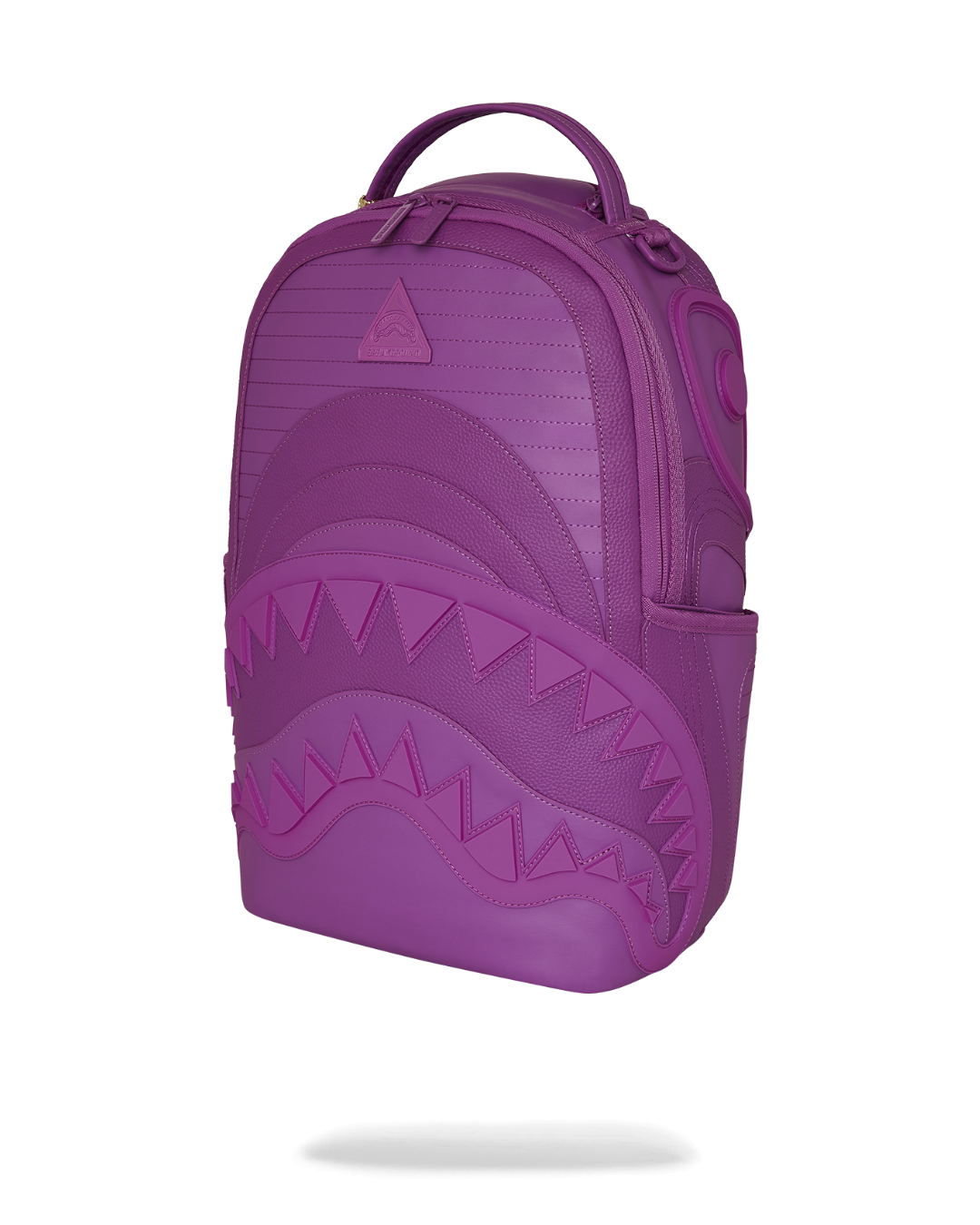 Backpack open showing velour laptop compartment and organizer pockets