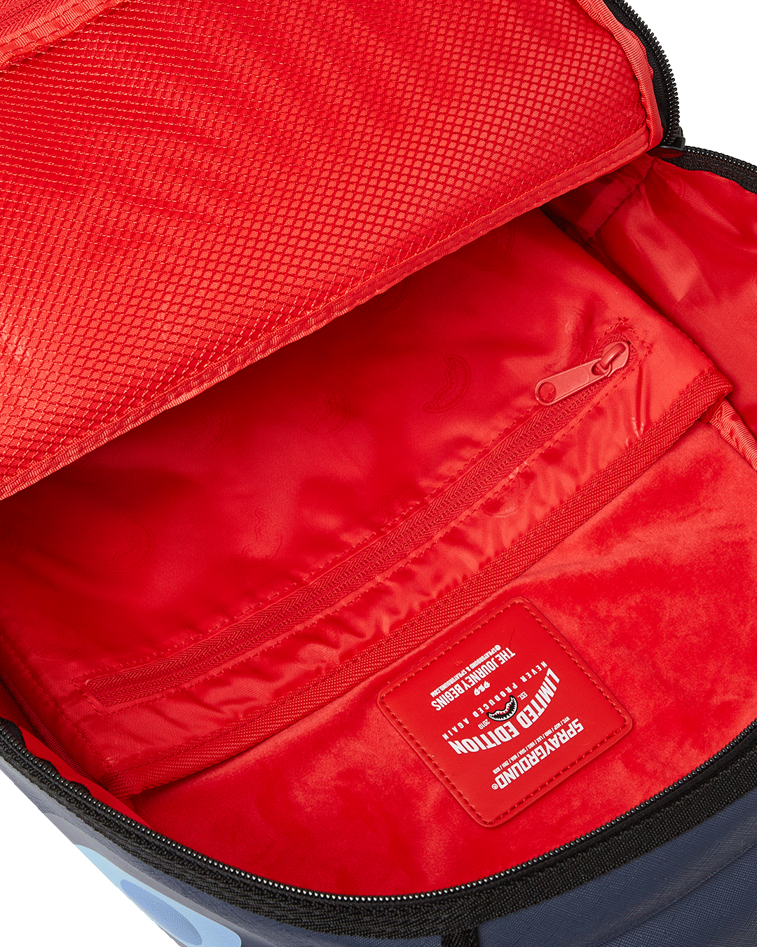 Pink Sprayground backpack worn casually, showing adjustable straps and side pockets.