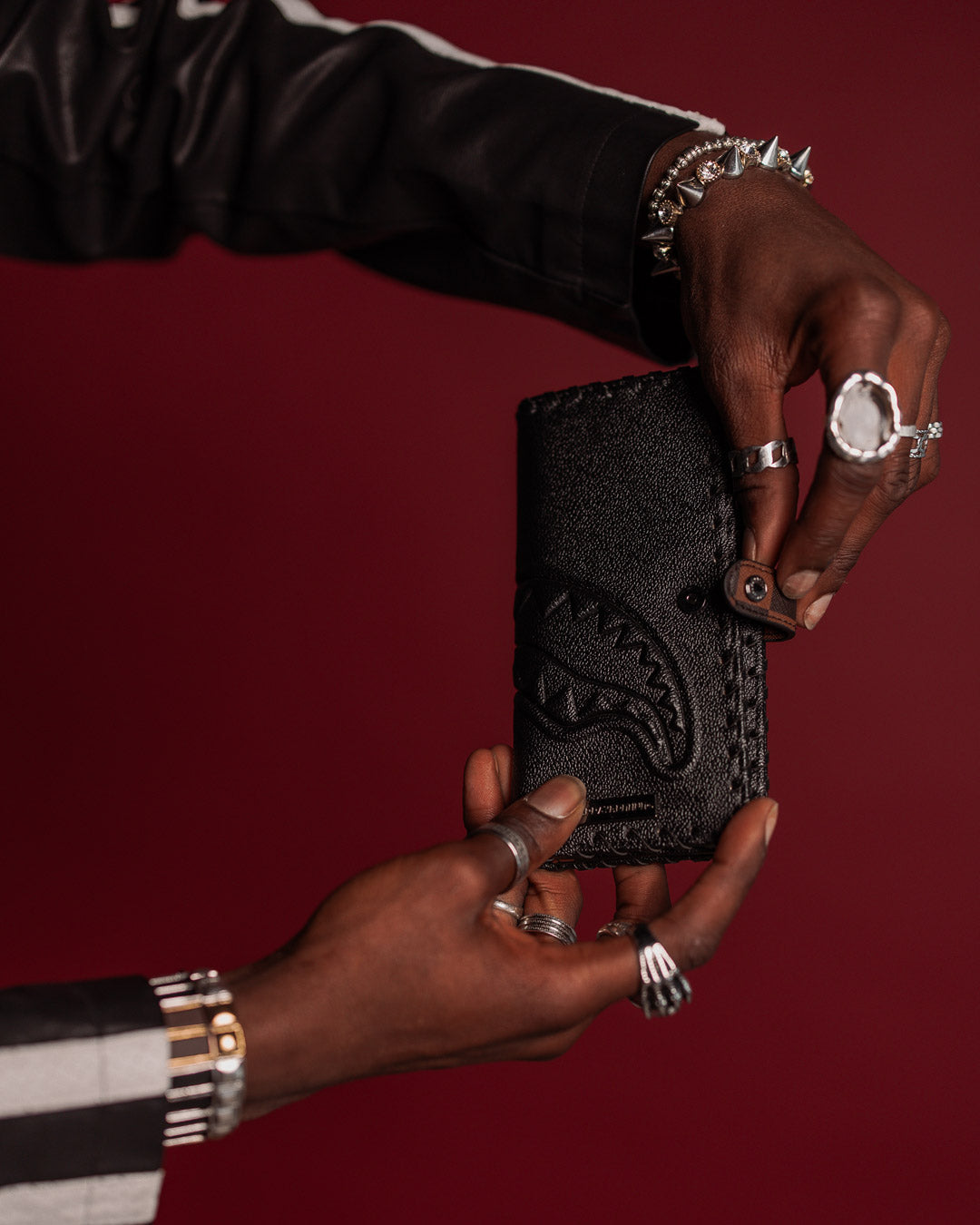 Front view of Checkpoint Royale tri-fold wallet with embossed design.