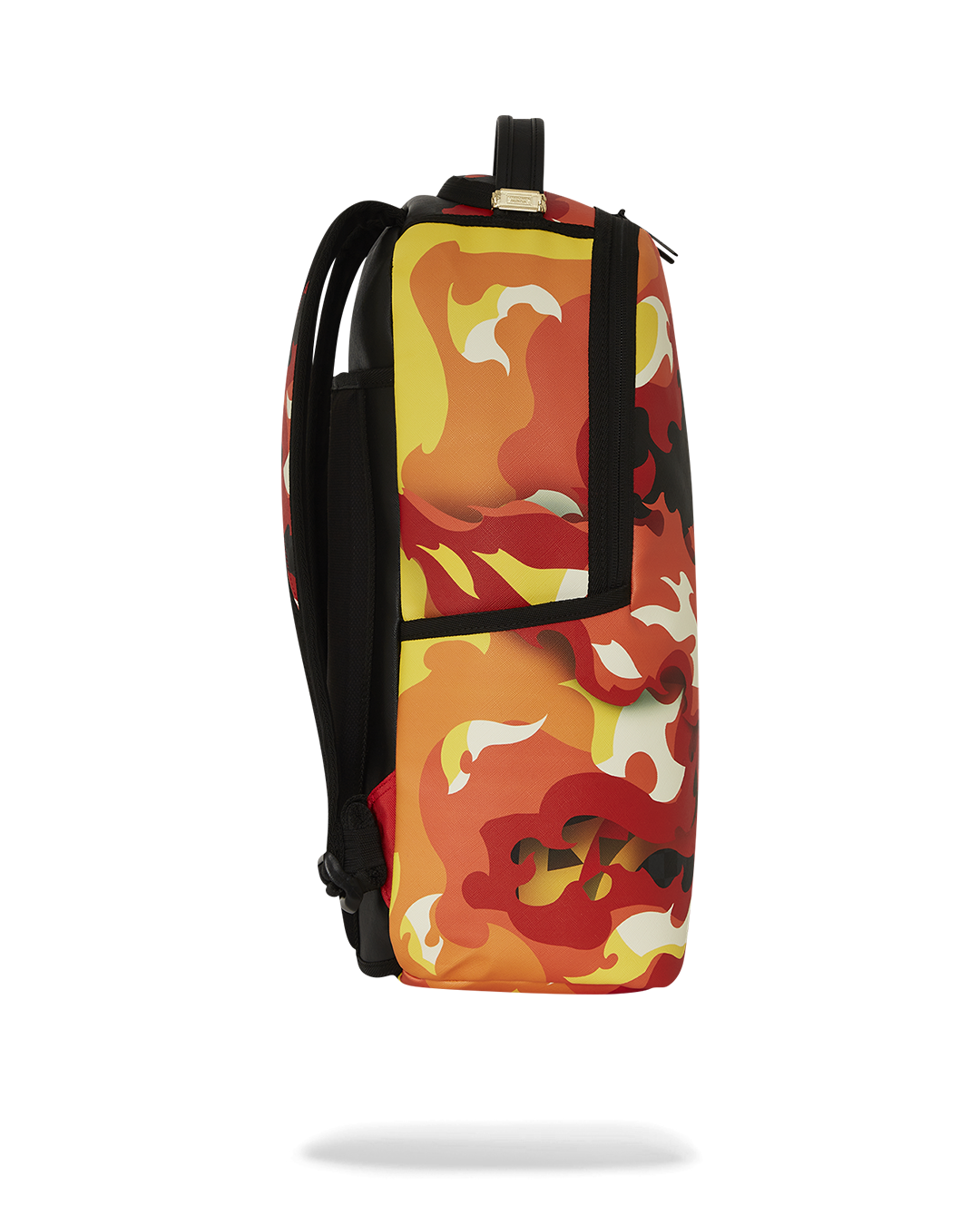 Faux leather backpack with gold zippers and metal hardware, connected to carry-on luggage